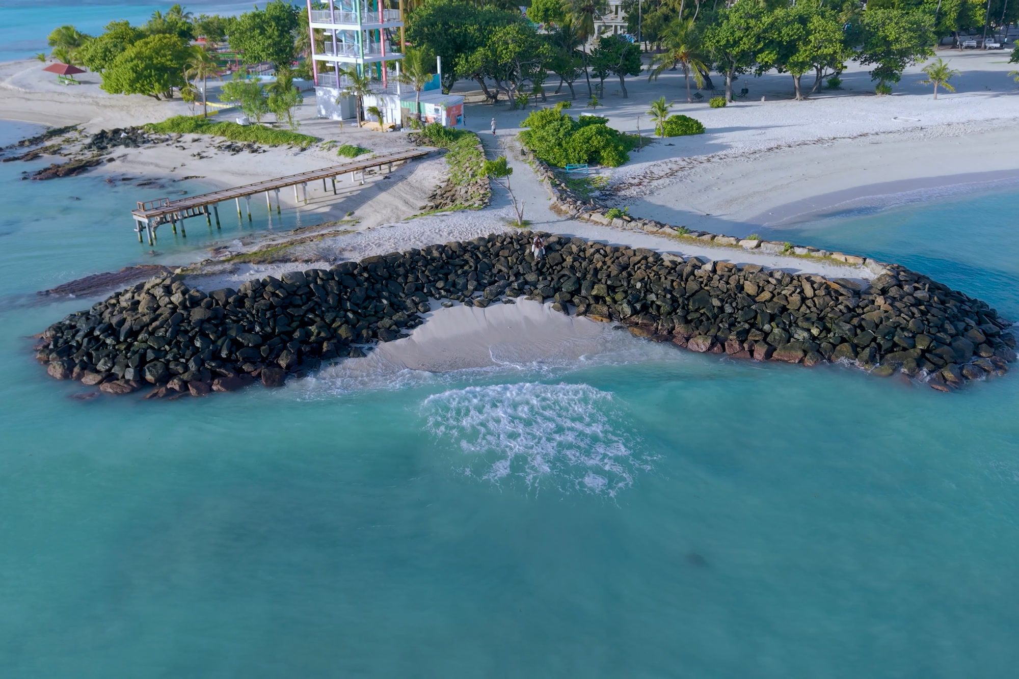 A rock breakwater protecting a Maldivian shoreline